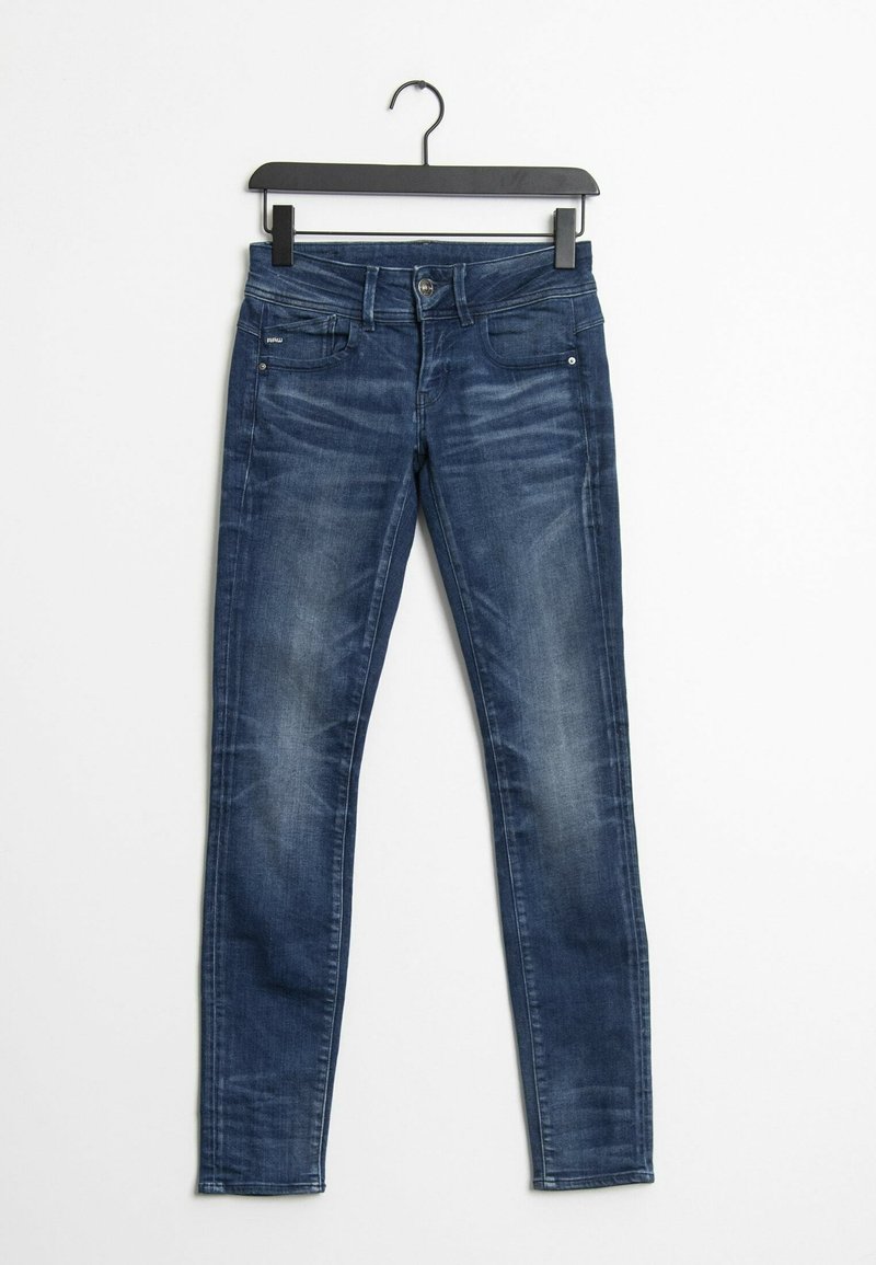 Smaljeans i mörkblå denim, med midjehög midja, fem fickor, lätt blekning och en slät, texturerad yta.