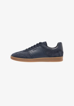 Men’s navy blue suede and leather sneaker with lace-up front and gum rubber sole, side perforations, and branded panel.