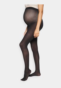 Collants de maternité noirs avec une texture transparente, une taille lisse et un design ajusté, conçus pour le confort et le soutien.