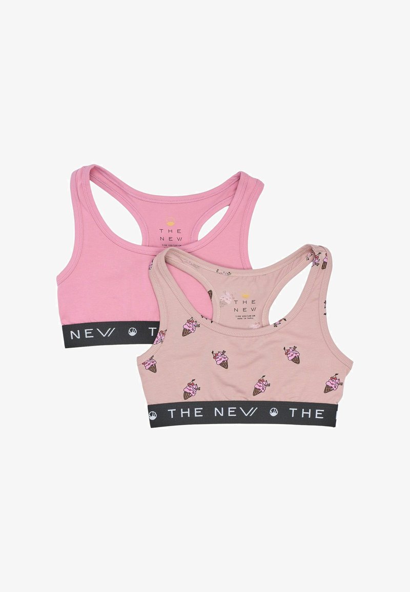 Dve tielka: jedno jednofarebné v svetloružovej farbe a druhé béžové s farebným vzorom zmrzlinových kociek. Obe majú čierny elastický pás s textom "THE NEW".
