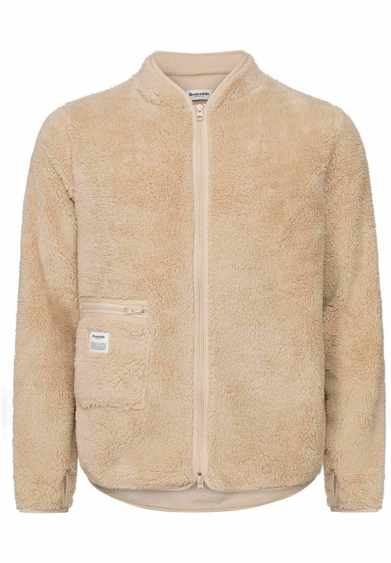 Beige Fleecejacke mit Reißverschluss vorne, Stehkragen und Seitentasche. Weicher Stoff, lockere Passform und detaillierte Nähte.