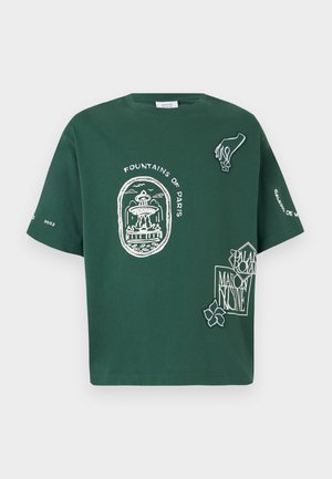 Green short-sleeve T-shirt with "Fountains of Paris" fountain graphic, hand holding flower, and text designs on front and sleeves.