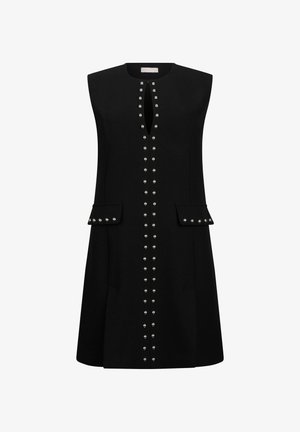 Varrukateta must kleit ümarate kaelusega, keskel vertikaalne rida hõbedasi naelu, ees kaks klapiga taskut, mis on samuti kaunistatud hõbedaste naeltega.