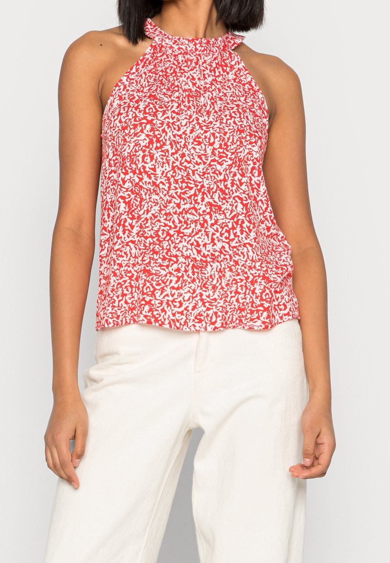 Blusa senza maniche a righe rosse e bianche con scollatura arricciata, caratterizzata da una vestibilità comoda e un tessuto leggero.