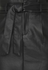 Black faux leather belted trousers featuring a smooth texture, front pockets, and a tied waist detail for adjustable fit.