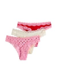 Σετ τριών γυναικείων στρινγκ σε ροζ, λευκό και κόκκινο. Διαθέτουν δαντελένιο περίγραμμα, σχέδια με καρδιές στο ροζ ζευγάρι και διάφανο υλικό.