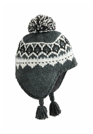 Dark gray knitted winter hat with ear flaps, white geometric pattern, top pom-pom, and braided tassels hanging from each flap.