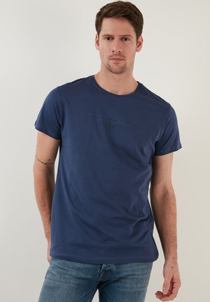 Navy blue short-sleeve t-shirt in soft fabric with a crew neck. Features a subtle embossed graphic on the front and a relaxed fit.
