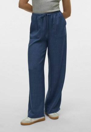 Pantalons légers à jambes larges en tissu bleu marine. Dotés d'une taille élastique avec un cordon de serrage et de deux poches latérales. Texture lisse.