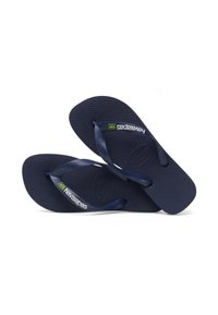 Sötétkék Havaianas flip-flop papucsok, texturált gumitalppal és kontrasztos pántokkal, kis brazil zászló részlettel.