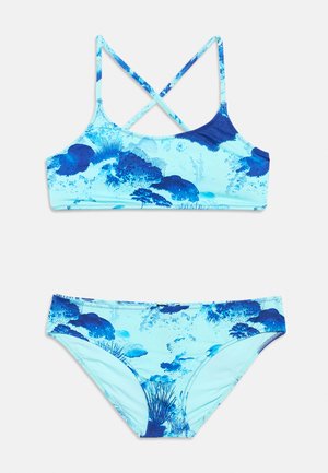 Blue and light blue two-piece swimsuit with cross-back straps and underwater coral reef pattern.