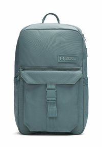 Gray-blue backpack with a rectangular shape, made of textured fabric, featuring a front pocket, adjustable straps, and an Under Armour logo.
