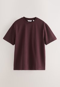 Camiseta de algodón burdeos con mangas cortas, cuello redondo y diseño liso, que presenta un corte recto y textura suave.