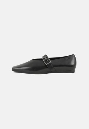 Black leather flat shoe with a pointed toe, featuring a metallic buckle strap across the instep and a low, flexible sole.