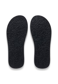 Μαύρα πέλματα με υφή που παρουσιάζει γεωμετρικά σχέδια, σχεδιασμένα για άνεση και σταθερότητα. Λείες άκρες και περιγραμμμένο σχήμα.