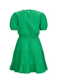 Green, tiered dress with puff sleeves and smocked waistband. Includes a keyhole back detail and a textured fabric finish.