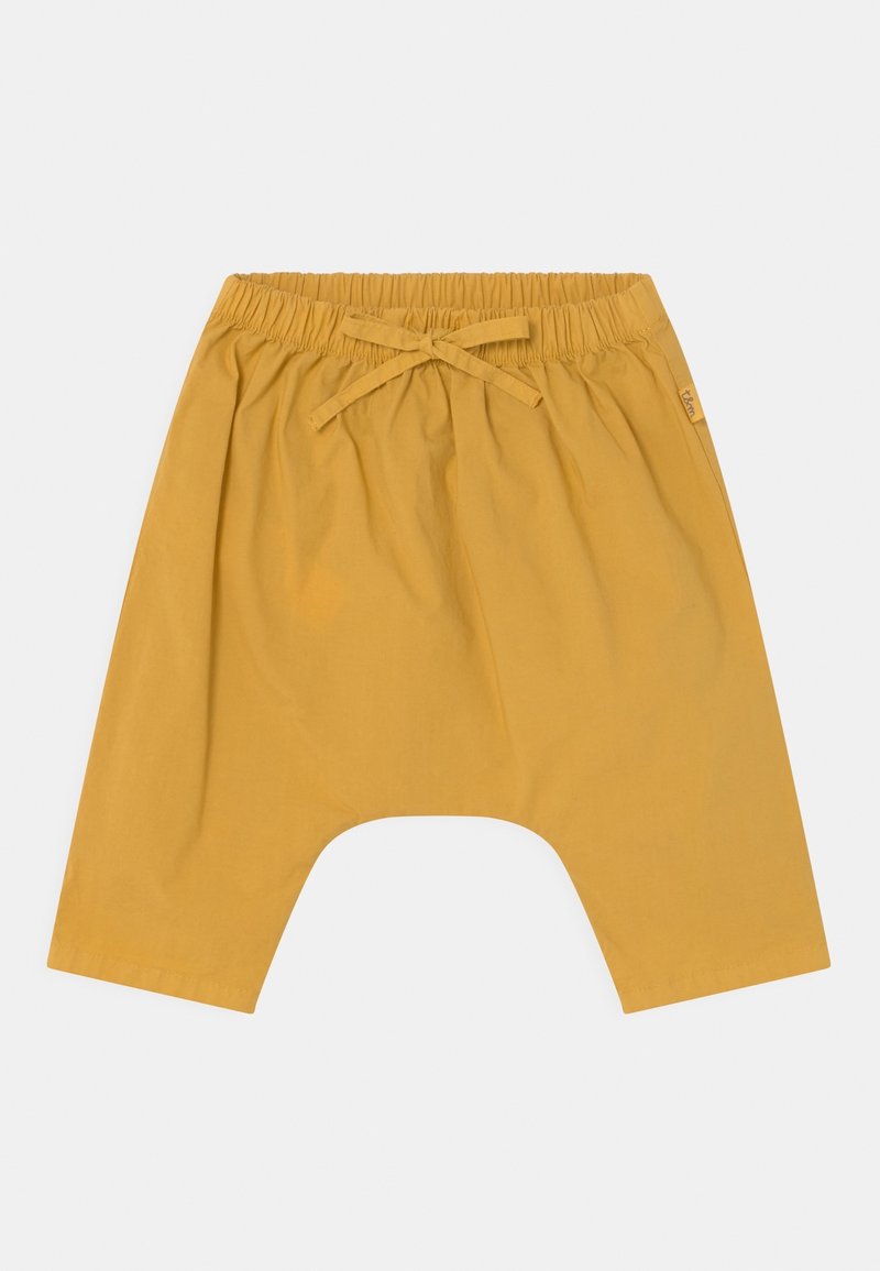 Pantalon sarouel en coton jaune avec une taille élastique et un nouage à l'avant. Caractérisé par une entrejambe basse et des jambes larges pour plus de confort.