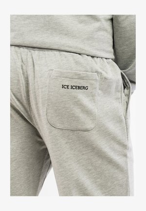 Gray sweatpants with a textured fabric, featuring a back pocket with the black embroidered text "ICE ICEBERG." Elastic waistband detail.