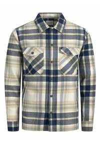 Chemise à carreaux bleue, beige et blanche. Présente deux poches poitrine avec rabats et un col classique. Texture de tissu douce.