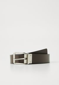 Brown leather belt with a silver rectangular buckle, featuring a polished finish and a smooth texture. Notable branding on the buckle.