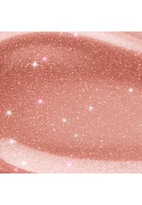 Paillettes or rose scintillantes avec des reflets lumineux étincelants sur une surface lisse et courbée.