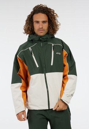 Groene en witte jack met rits, met oranje accent, textuurstof, verstelbare capuchon en ritszakken op de borst. Witte paneel aan de onderkant.
