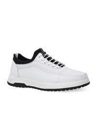 White sneakers featuring a mesh upper, black elastic collar, black accents, and a thick white sole with textured black tread.