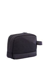 Zwarte toiletzak met een textuurstof aan de buitenkant, een strak ontwerp en een bovenste ritssluiting met een zijhandvat voor eenvoudig dragen.