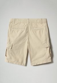 Pantaloni cargo beige con una vestibilità rilassata, dotati di due tasche laterali, due tasche posteriori e una texture liscia. Vita elastica per un maggiore comfort.