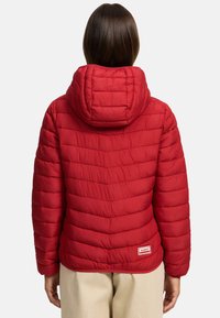 Red puffer jacket with a quilted design, featuring a hood and elastic cuffs. Includes a small logo label at the lower back.