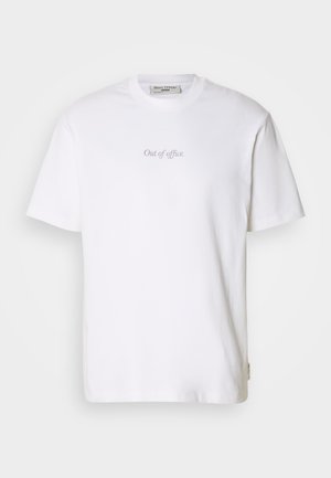 White cotton t-shirt featuring the text "Out of office" printed in light gray on the front, round neck, and short sleeves.