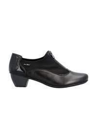 Chaussure femme noire à talon bas avec fermeture éclair sur le dessus, cuir lisse et brillant, et coutures décoratives sur le côté.
