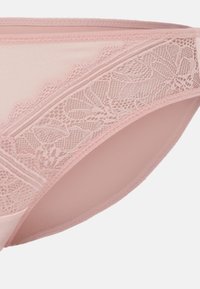 Pink lace brief featuring a smooth, soft texture with detailed floral lace trim at the waistband and sides, designed for a fitted look.