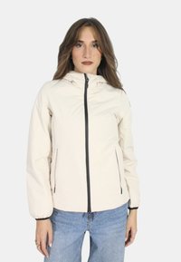 Giacca zip-up beige chiaro con cappuccio, zip nera, polsini elasticizzati e tasche laterali. Tessuto morbido e leggero con dettagli di trama sottili.