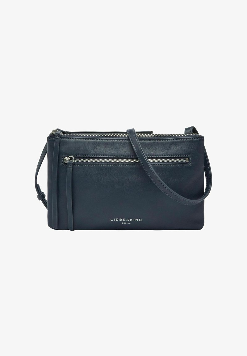 Petit sac bandoulière en cuir noir avec deux compartiments zippés et une bandoulière réglable, marqué Liebeskind Berlin à l'avant.