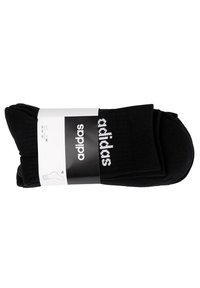 Schwarze Baumwollsocken mit geripptem Textur, versehen mit dem weißen "adidas" Logo. Verpackt mit einem Etikett, das Größe und Anzahl angibt (3 Paare).