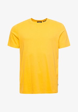 T-shirt en coton jaune à manches courtes, col rond et ourlet droit. Présente une texture douce et un branding minimal sur le col.