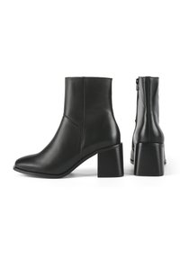 Black leather ankle boots with a pointed toe and a chunky block heel. Features side zipper and seam detailing for design enhancement.