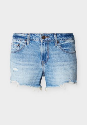 Modré rifľové šortky s opranými lemy a miernym poškodením na prednej ľavej strane, vybavené prednými vreckami a zapínaním na gombík.