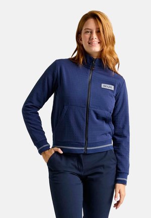 Veste zippée navy avec une surface texturée, col montant et poches latérales. Présente des rayures blanches en accent aux poignets et à l'ourlet.