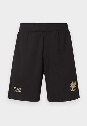 Mustat urheilushortsit, jotka on valmistettu teksturoidusta kankaasta. Niissä on kultainen logo ja koristuksia lahkeen läheisyydessä. Mukavuuden takaava joustava vyötärönauha.