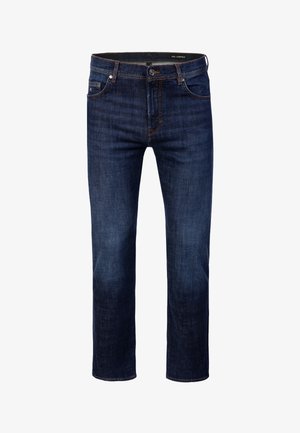 Tummansiniset suoralahkeiset farkut, joissa on etutaskut, nappikiinnitys ja näkyvät saumat.