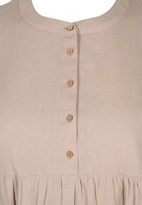 Beige linen dress with a round neckline, featuring five wooden buttons down the front and a gathered hemline.