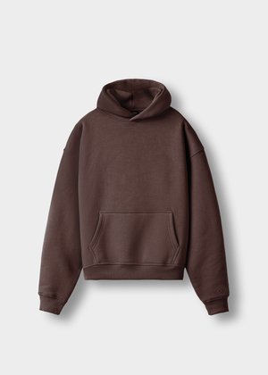 Brown oversized hoodie made of soft fabric with a kangaroo pocket, ribbed cuffs, and hem. Features a large hood and simple design.