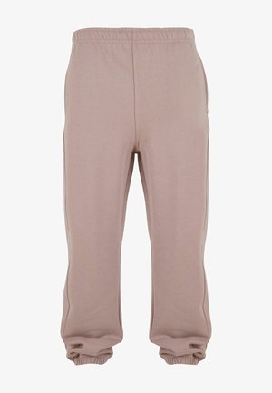 Lyserøde joggerbukser lavet af blødt stof, med elastisk talje og manchetter, samt sidelommer og en afslappet pasform.