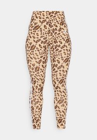 Leopardmönstrade leggins i tan med mörkbruna fläckar. Har vita sidosträck och hög midja. Tillverkade av elastiskt tyg.