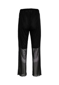 Mustad püksid läbipaistva tekstuuri ja väikeste hajutatud litritega. Omavad elastset vöökohaga ja lehvivat äärist.