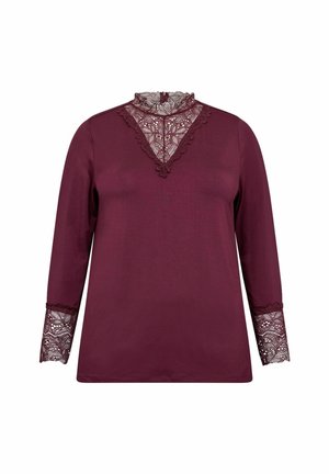 Burgundská dlouhá rukávová halenka s průhledným krajkovým výstřihem a krajkovými detaily na manžetách. Měkká tkanina s volným střihem a V-špice krajkovými detaily.