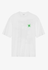 White cotton t-shirt with short sleeves, featuring a green star graphic on the left side. Simple design, crew neck, and relaxed fit.