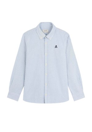Camisa de botones a rayas en algodón azul claro y blanco. Presenta un cuello clásico, mangas largas y un pequeño logo de calavera bordado en el pecho.